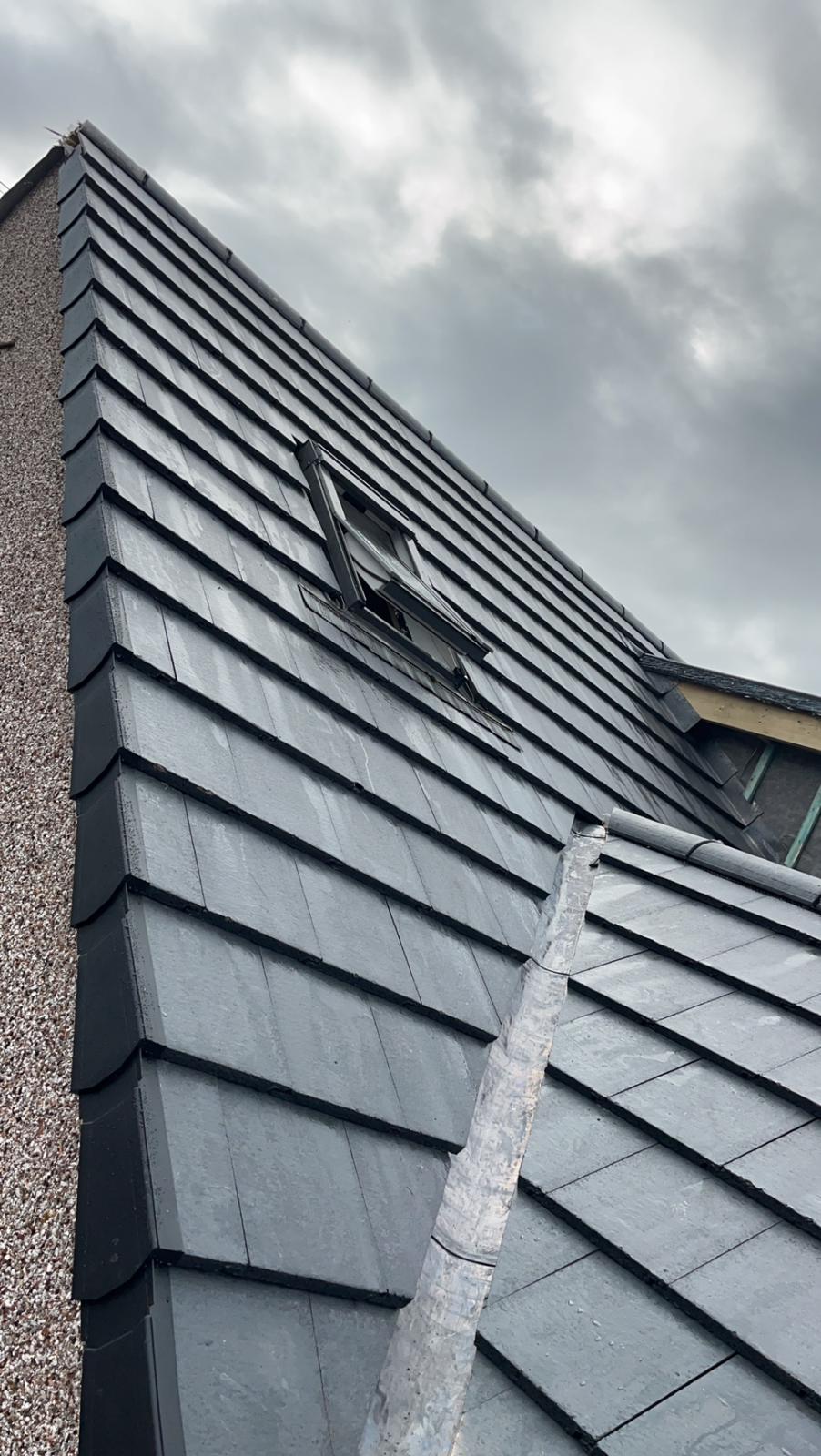 Roof covering, rooflight and valley detail